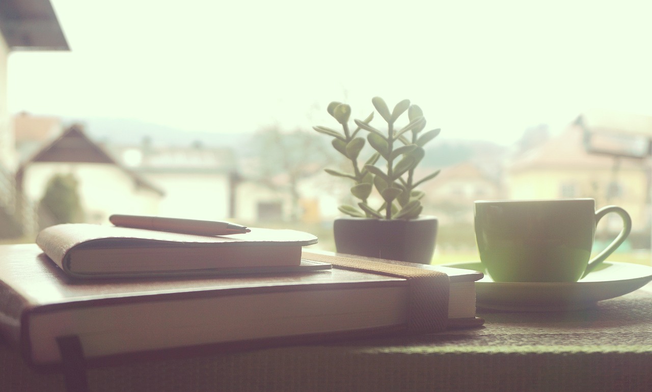 creative workspace notebook coffee